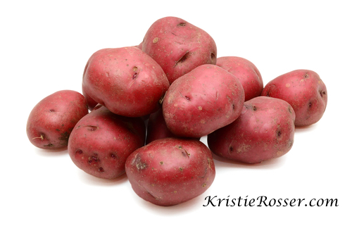 shutterstock_red potatoes on white background