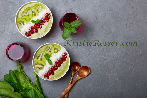 shutterstock_green smoothie bowl with kiwi and wooden spoon